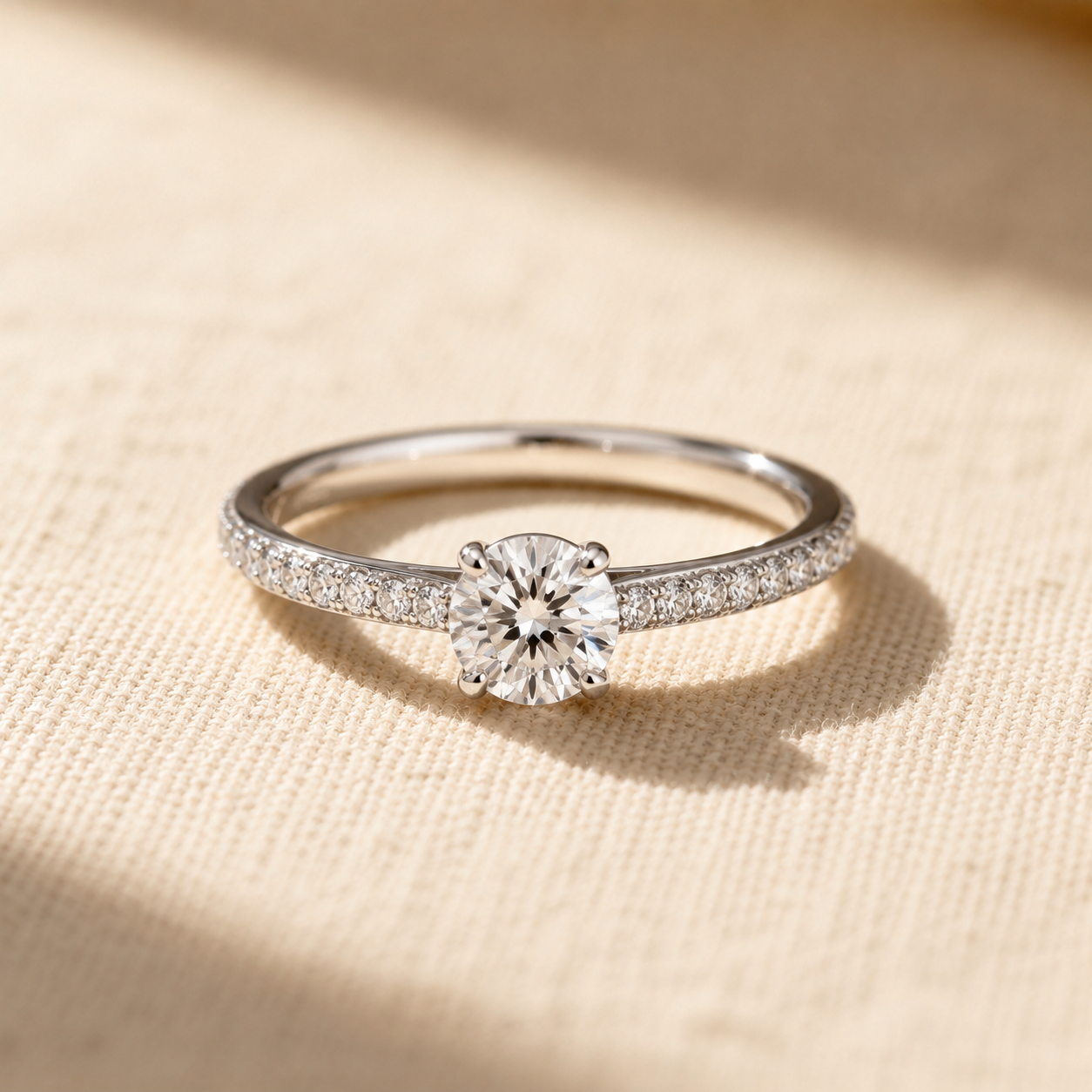 Engagement — pavé shoulders, brilliant cut
