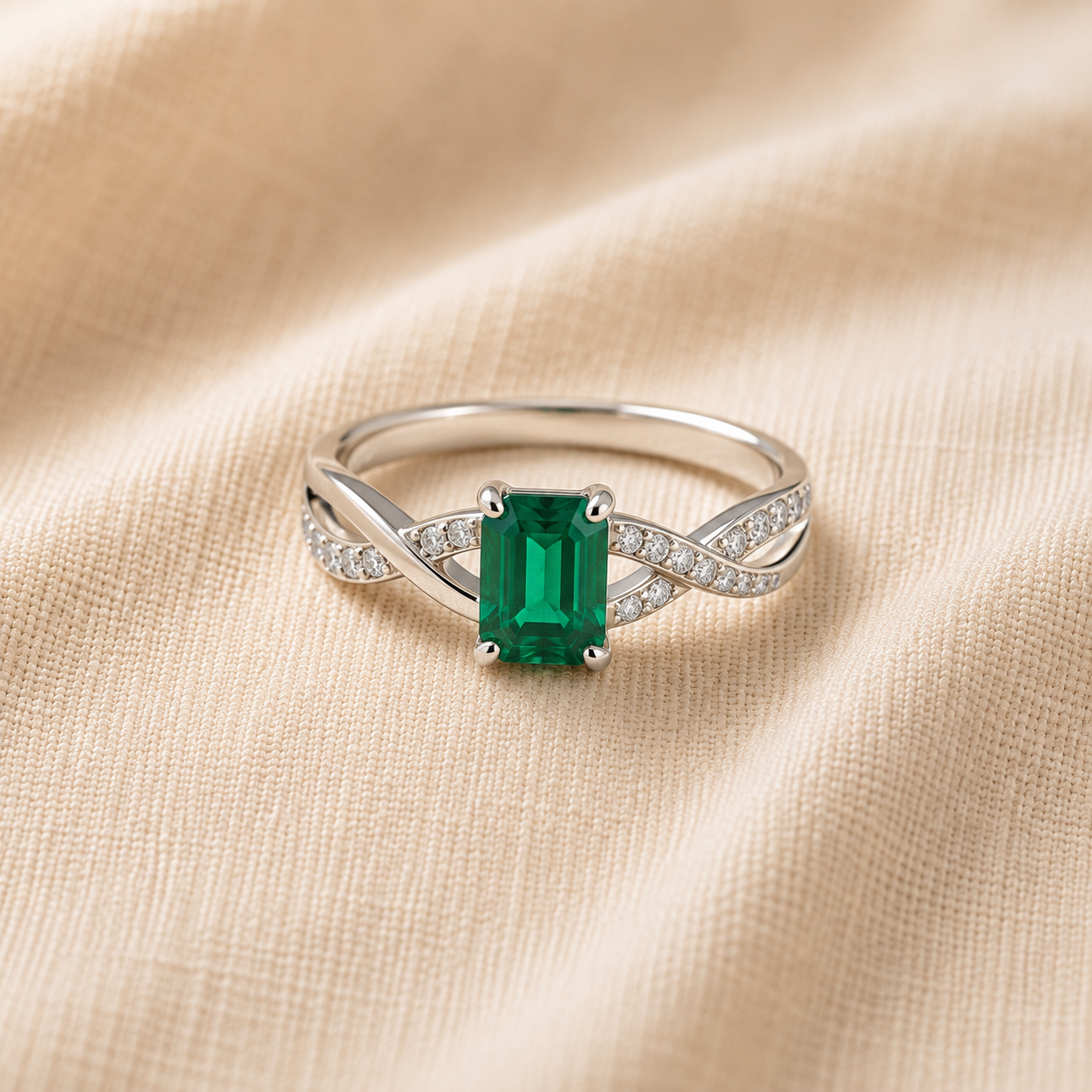 Emerald ring — twist shank, pavé set