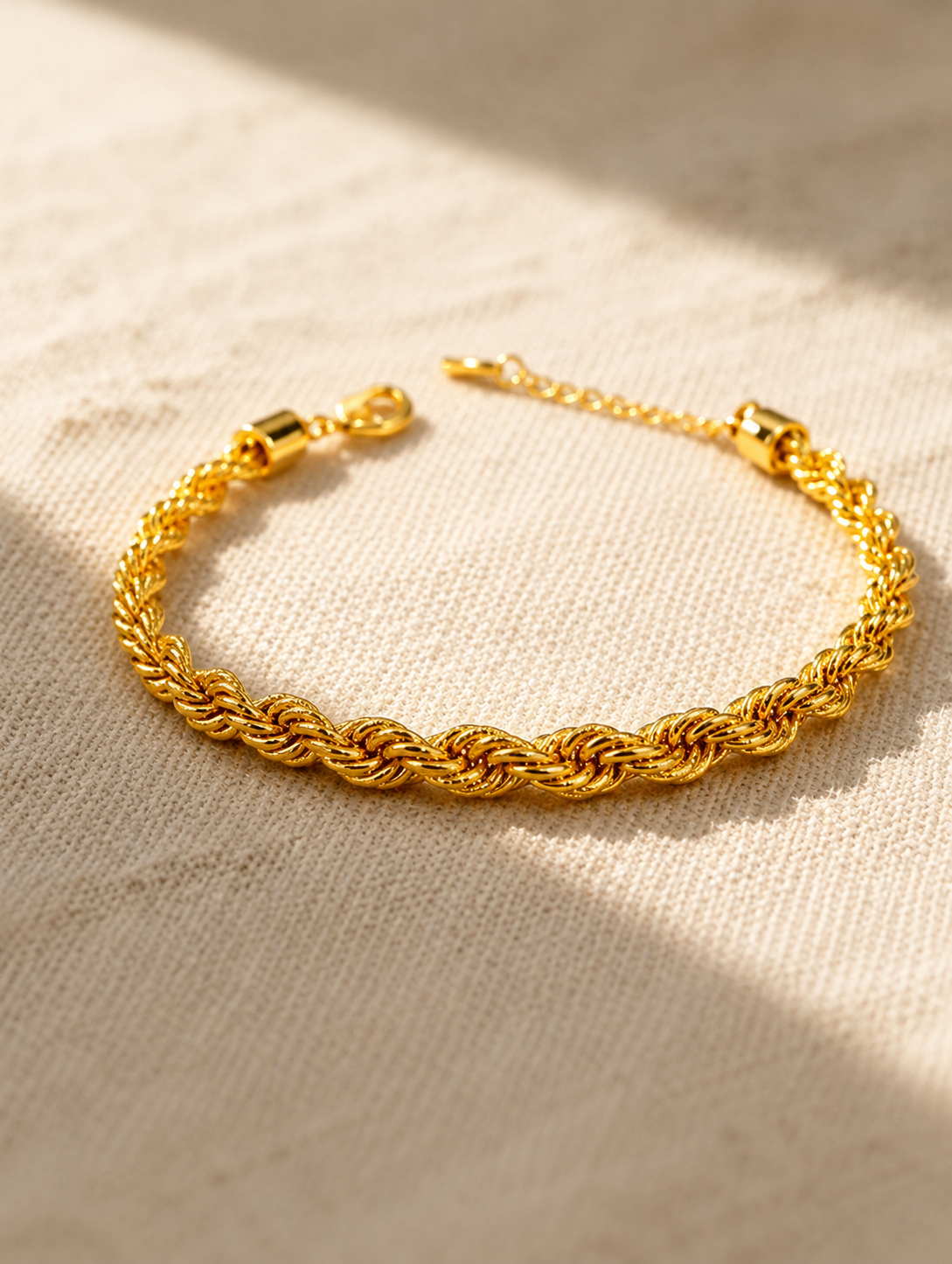 Heavy gold vermeil curb chain coiled on linen